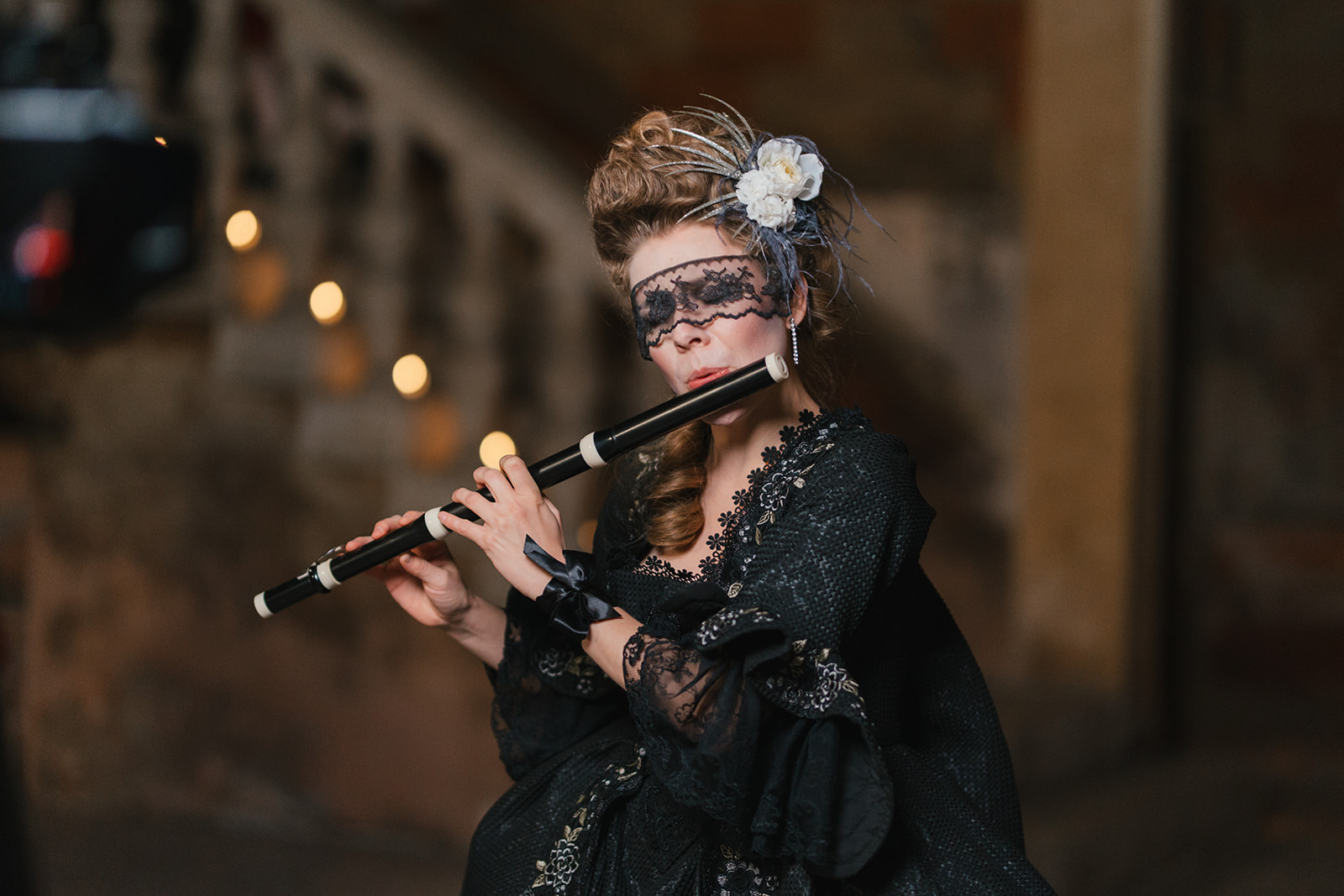 Masked flautist at night